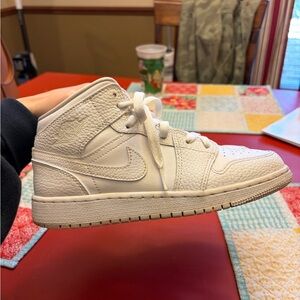 White Nike kids high top air Jordan’s